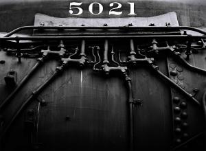 Closeup of the side of a steam locomotive boiler.